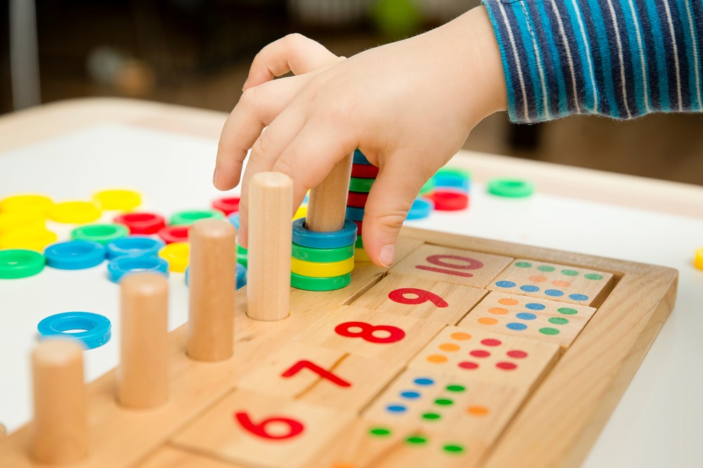 Child,Playing,With,Different,Color,Wooden,Rings.,Sequence,,Fine,Motor